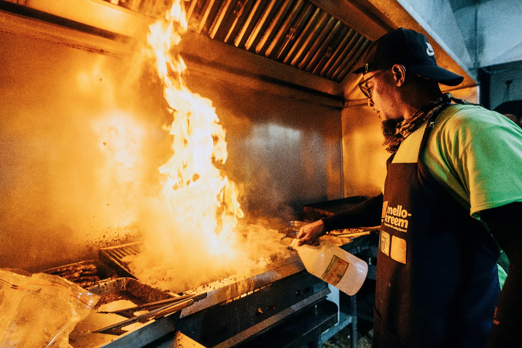 A Bajan chef grilling over open flames at the Food & Rum Festival