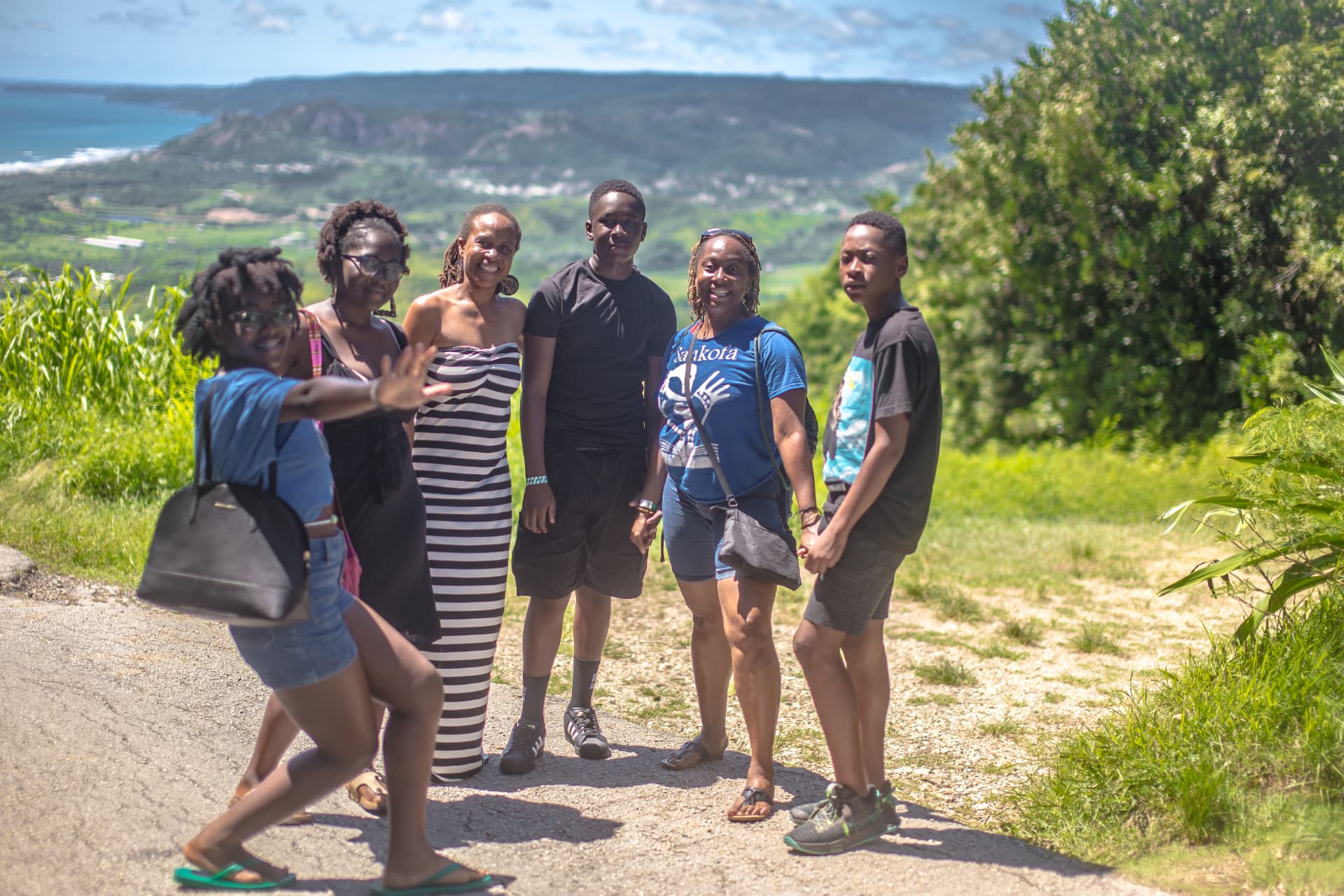 Sankofa travelers together on a Barbados hillside overlooking the sea