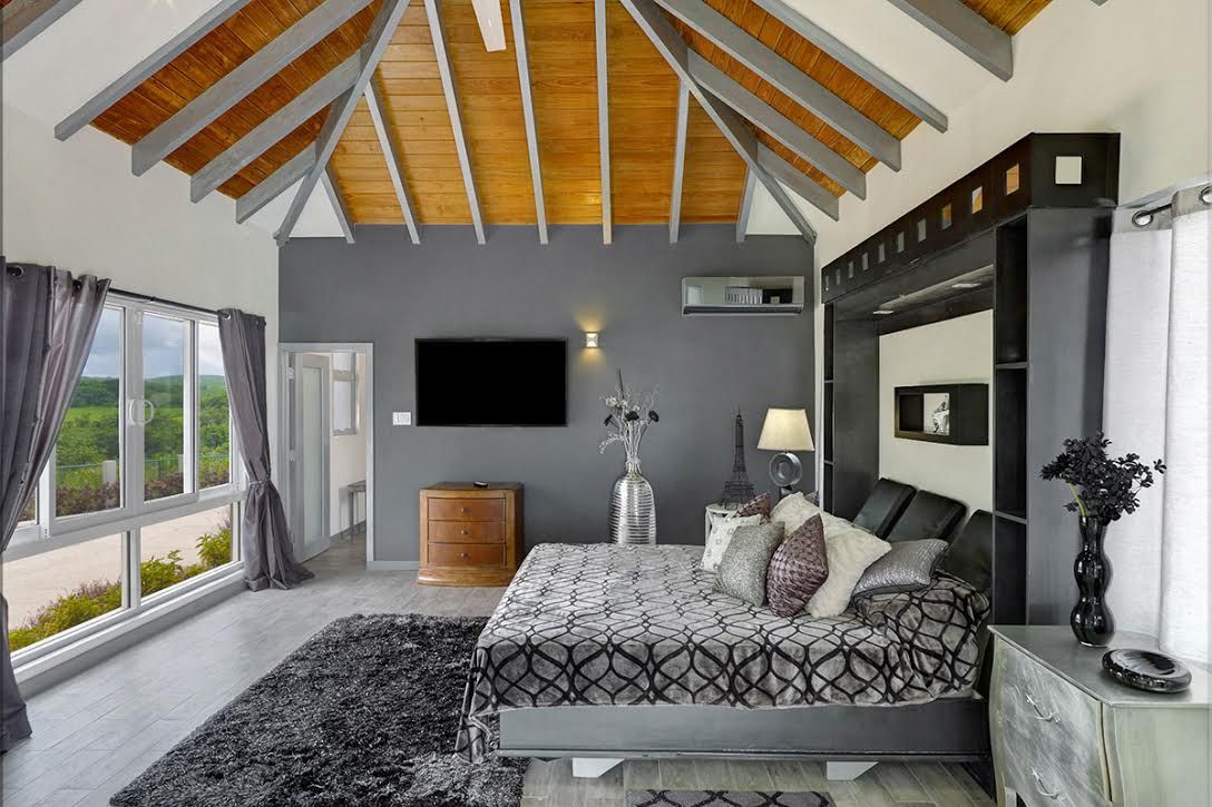 A vaulted-ceiling en-suite bedroom at La Maison Michelle