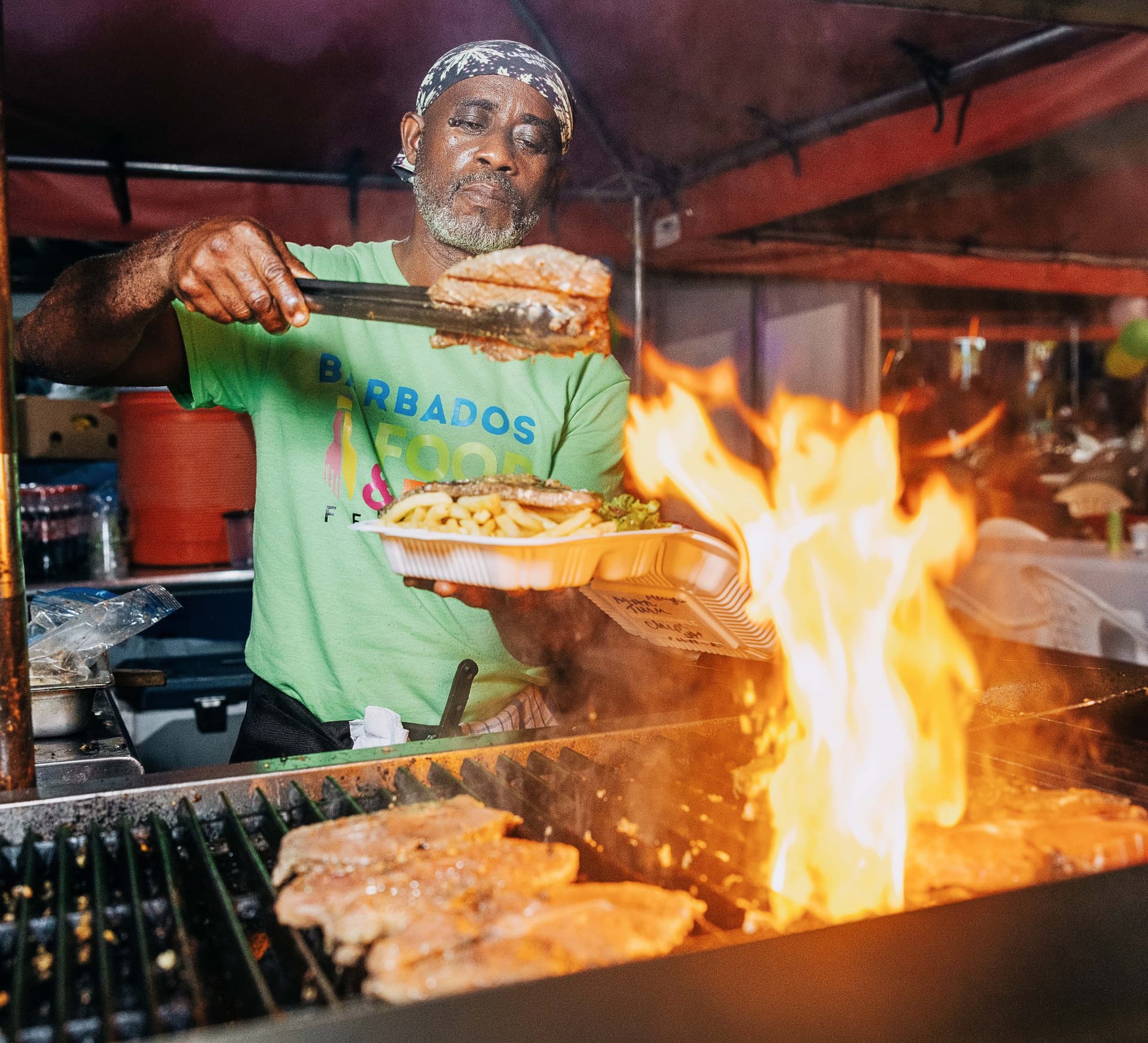 A chef preparing a dish at the Barbados Food and Rum Festival